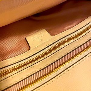 White/ cream color with Gucci Golf Logo